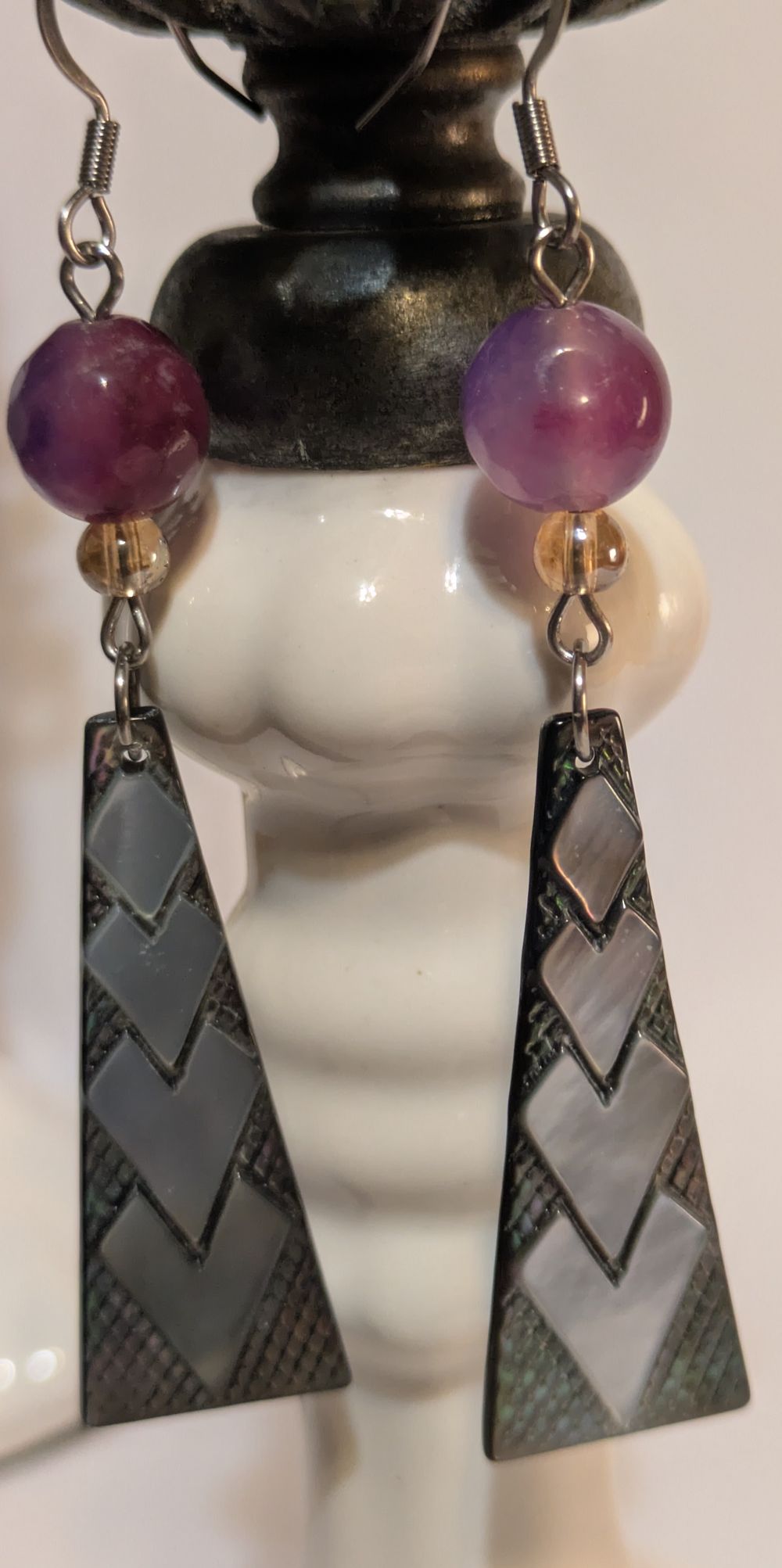 Stylized glass bead with abalone-finish earrings, purple sto...